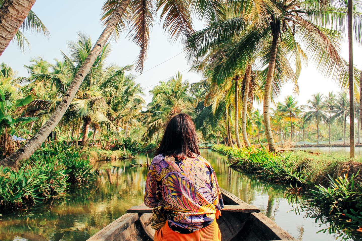 A woman kayaks along a canal surrounded by farmland. FMC has been recognized by recognized by CDP for leadership in climate action and water stewardship.